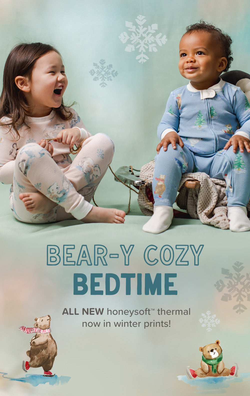Two children sitting on the floor wearing matching winter pajamas, with a light blue background and snowflake graphics. Large text reads 'BEAR-Y COZY BEDTIME' and smaller text says 'ALL NEW honeysoft thermal now in winter prints!'.