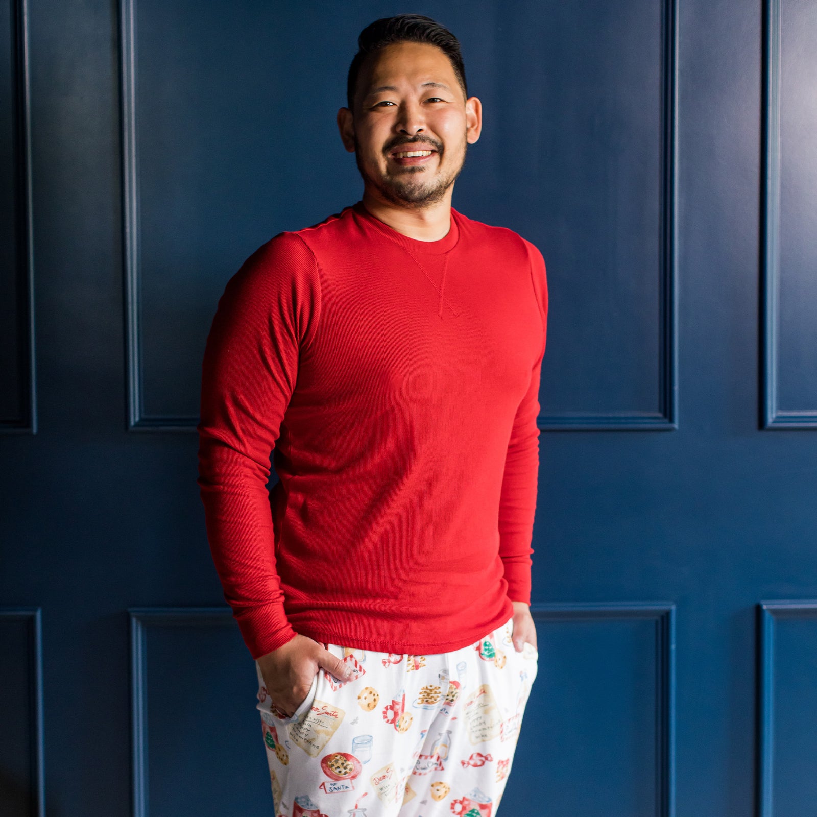 Men's organic cotton pajama set with red long-sleeve top and Santa print pants - View 2