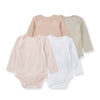 4-pack long-sleeve baby bodysuits, solid organic cotton in blush, beige, gray, and white.
