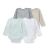 Set of four long-sleeve baby bodysuits in gray, cream, mint, and white.