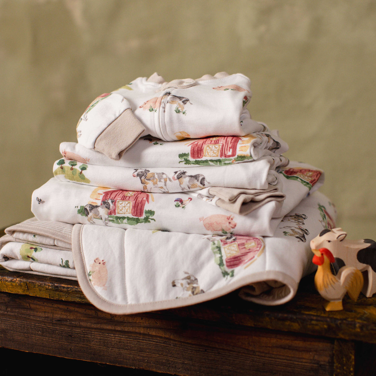 Reversible organic cotton baby blanket with farm animal print, folded - View 2