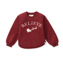 Burgundy sweatshirt with 'BELIEVE' lettering and reindeer sleigh graphic