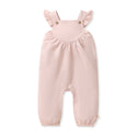 Organic baby girl jumpsuit in pale pink with gathered bib-style yoke and buttons