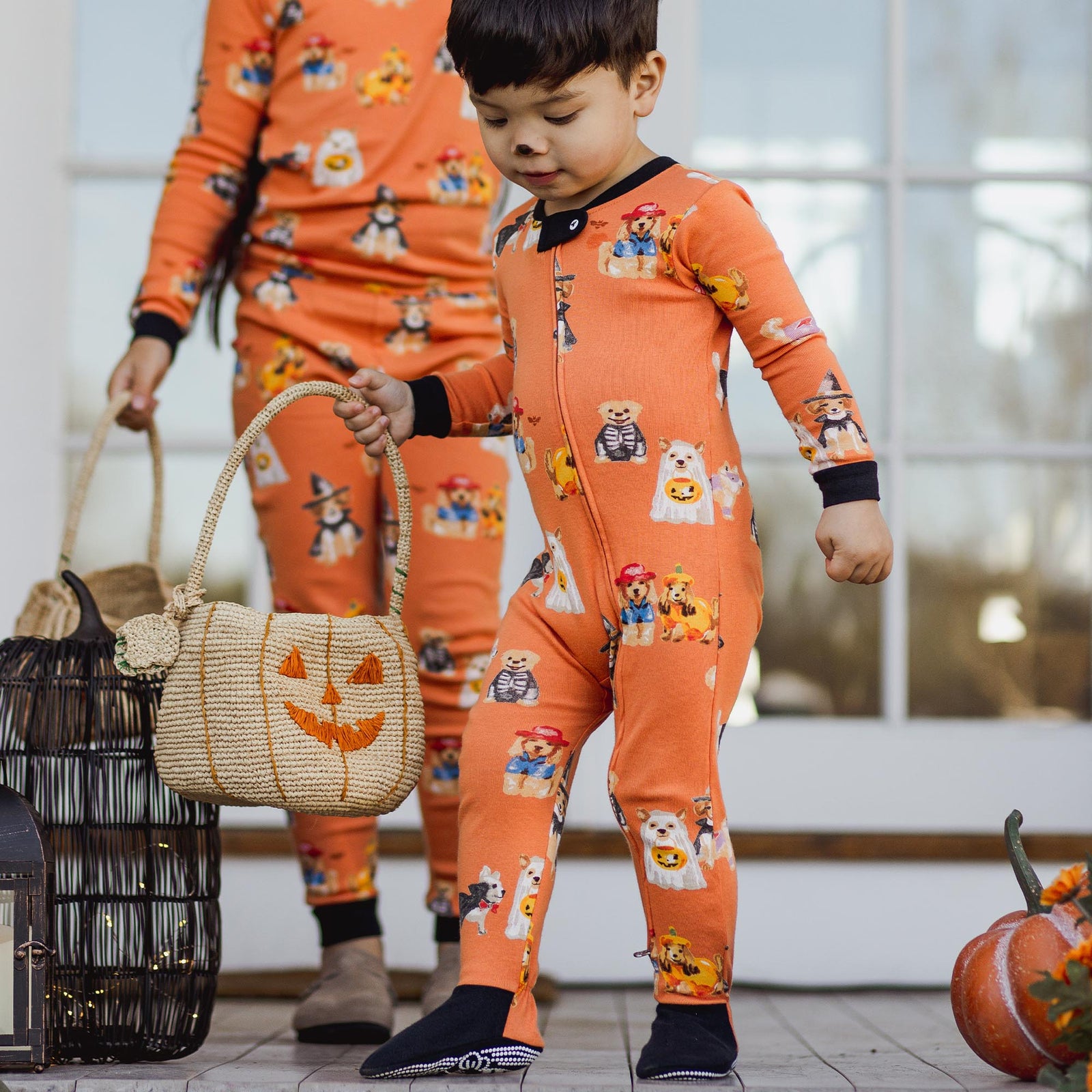Orange footed sleeper with black cuffs and allover cartoon dog costumes, zipper front - View 2