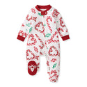 White footed sleep romper with candy cane and bow print, red cuffs, snap front
