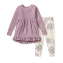 Mauve ruffle tunic dress with long sleeves and cream leggings with grey snowflakes