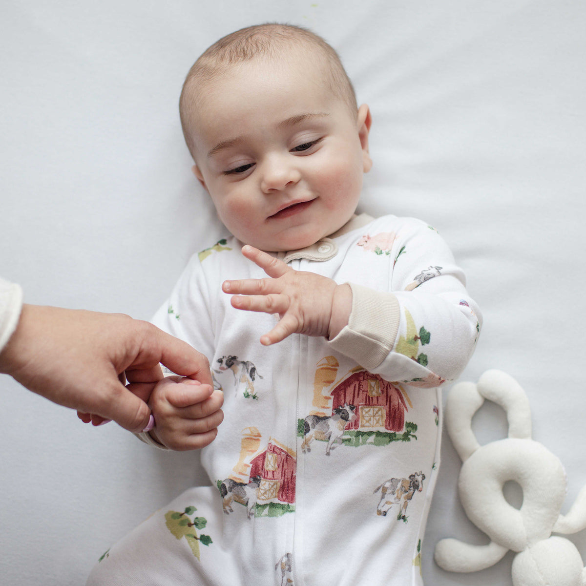Infant white cotton sleep and play pajama with colorful farm animal print and buttons - View 2