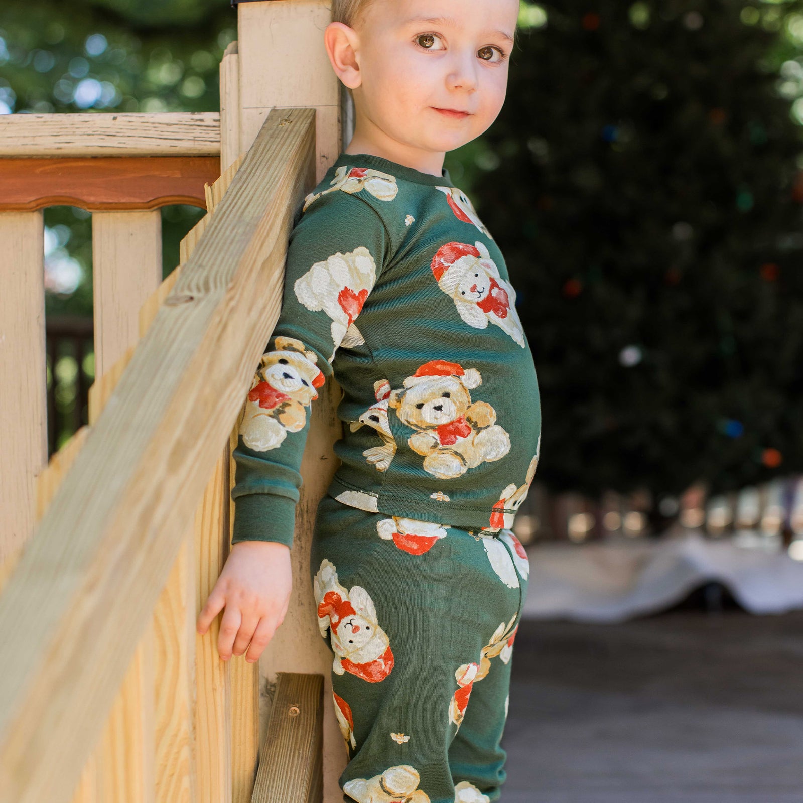 Green kids pajama set with long sleeves and cartoon holiday animal print, side view - View 2