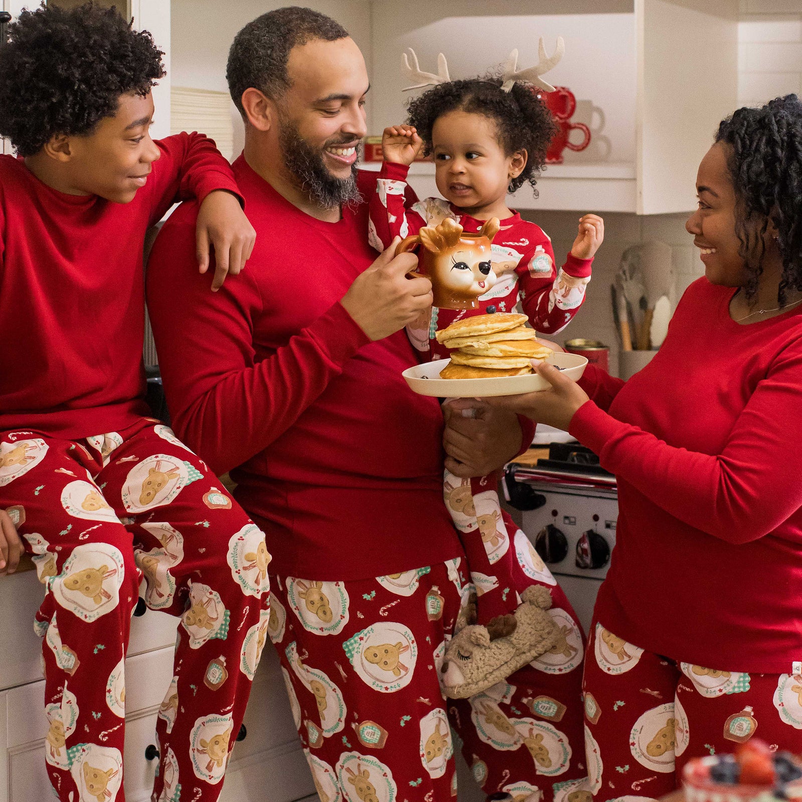 Red two-piece pajama set with festive animal print, long-sleeve top and pajama pants - View 2