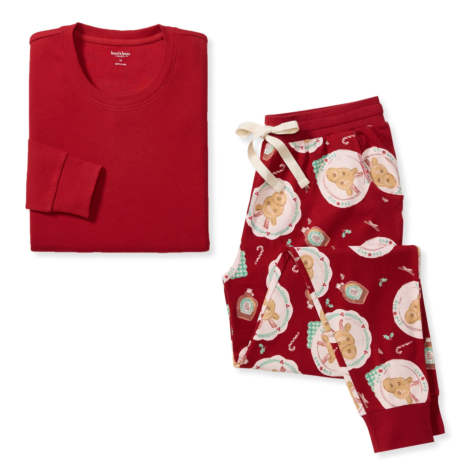 Women’s organic cotton pajama set with cream long-sleeve top and red holiday print pants - View 1