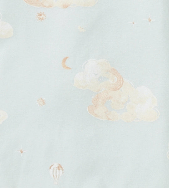Light blue fabric close-up with pale cloud and small star pattern